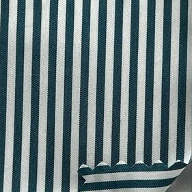A close-up of striped fabric with dark green and white vertical stripes, shown with a white ruler on the right side for scale.